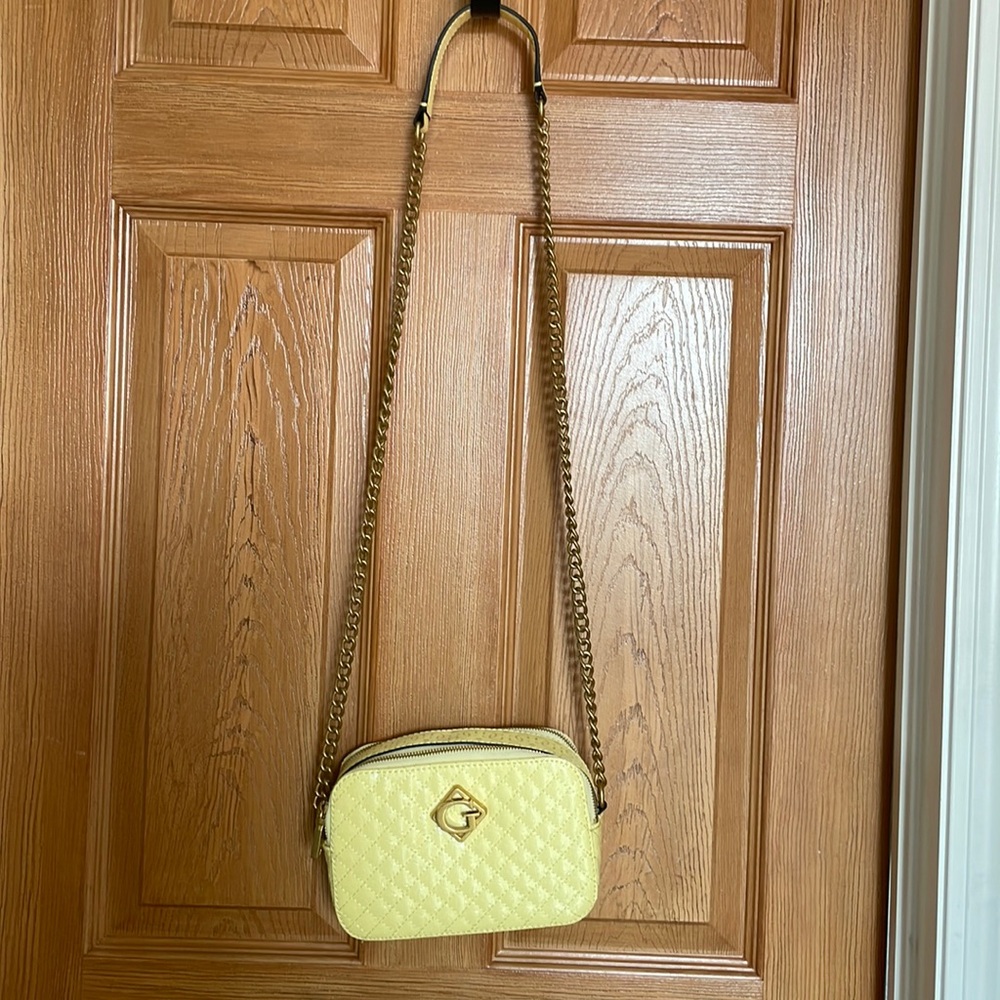 Guess should bag in pale yellow with gold hardware - like new !